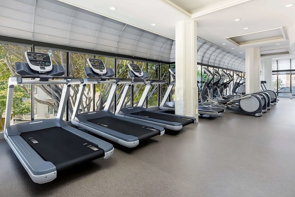 Energize your day with sunlit cardio and city views.