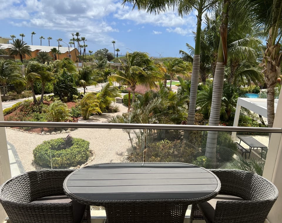 Gorgeous partial ocean views and stunning pool and garden view.  X-Long balcony.