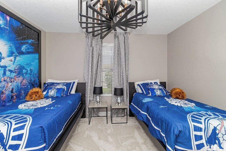 Step into a galaxy far, far away with our Star Wars-themed bedroom! Featuring two twin beds, cool blue tones, and epic decor, this room is perfect for young Jedi to rest and dream of their next intergalactic adventure. May the Force be with you!