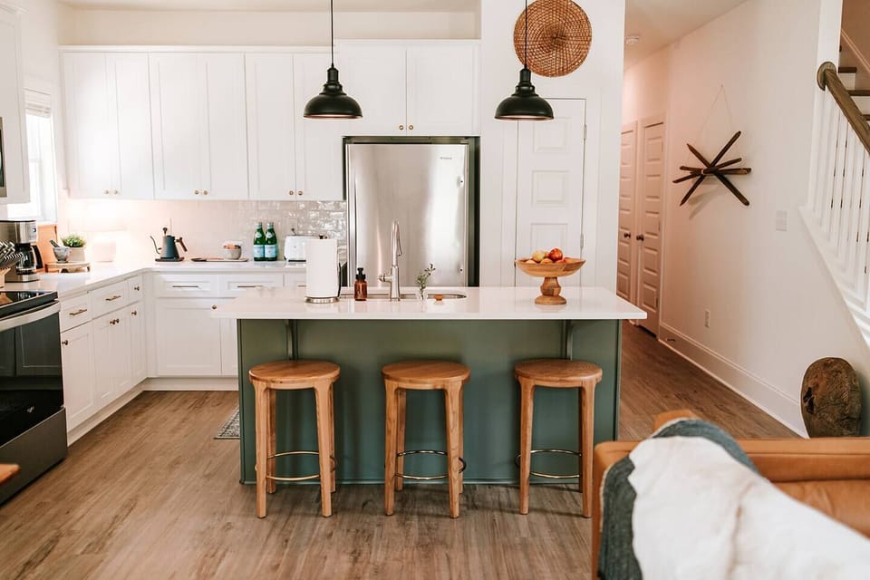 Fully stocked kitchen with bar seating for three. 