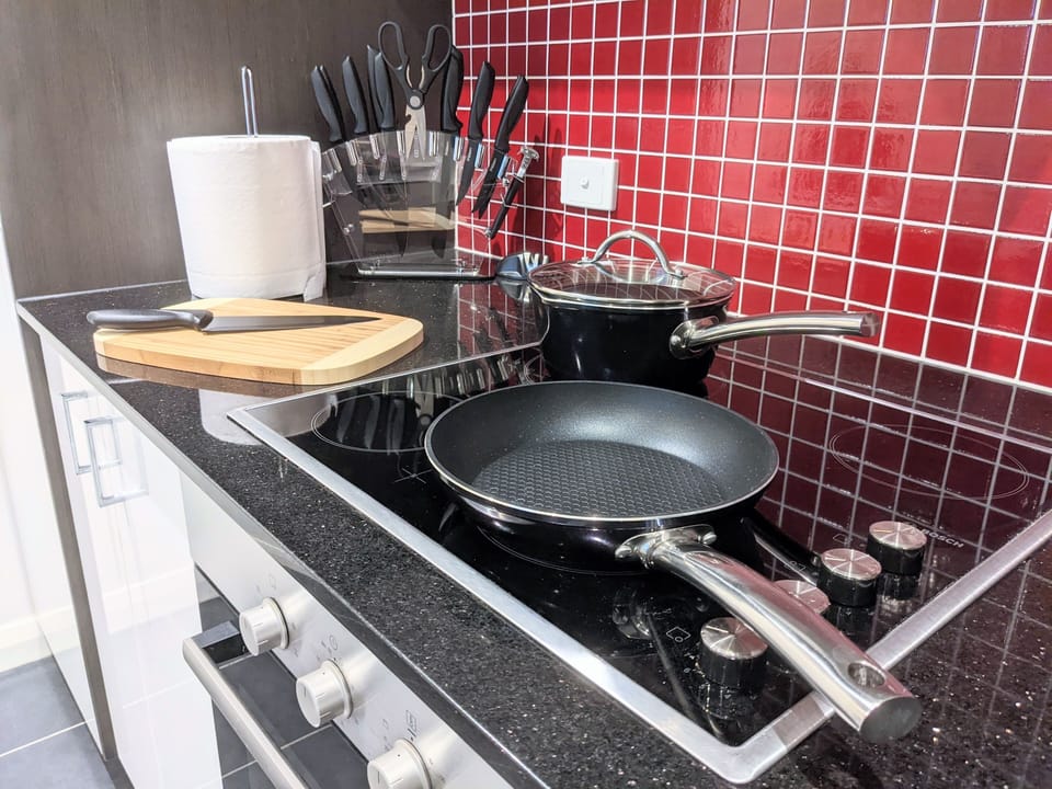 Kitchen with a range of utensils and pots