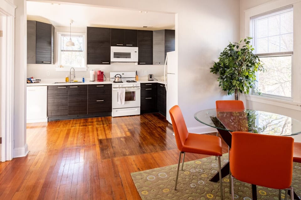 Fully equipped with a microwave, oven, range, and breakfast nook—complete with a Keurig and coffee essentials. Adjacent to the dining area.