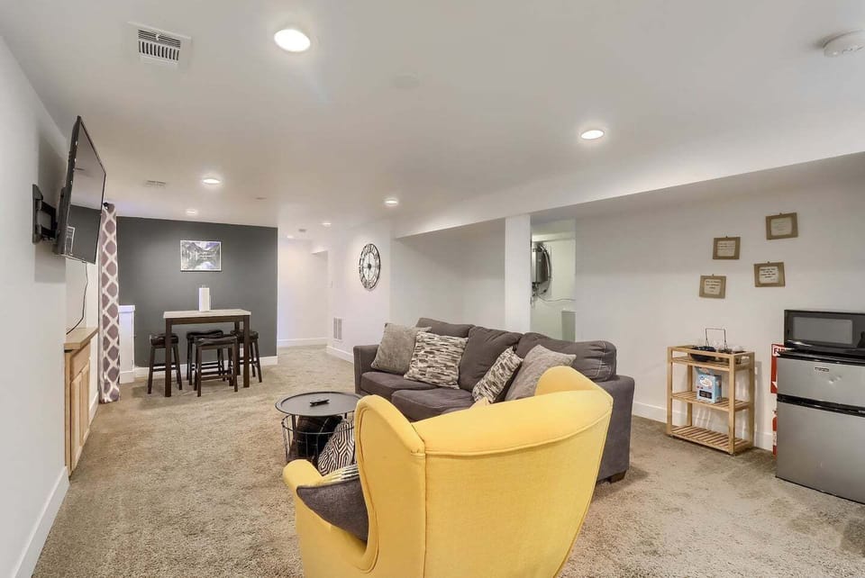 The downstairs living area also includes a mini fridge and microwave, and additional space for lounging and entertaining.