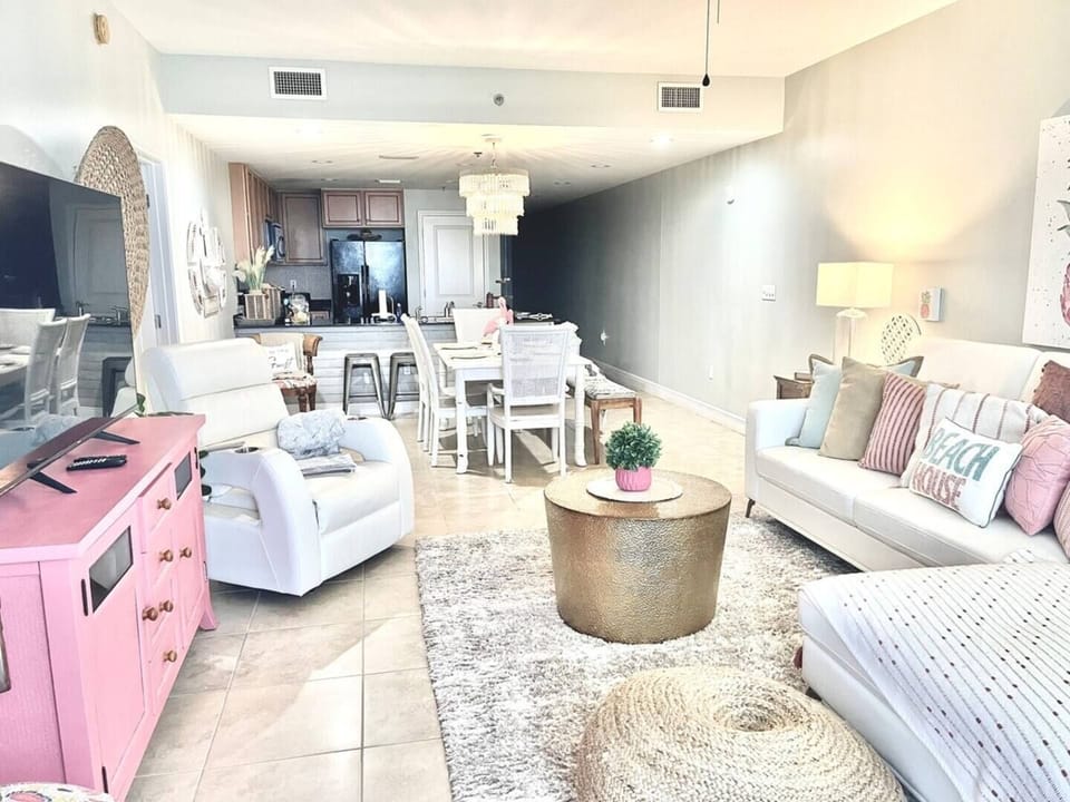 Looking from the balcony door into the dining area and kitchen