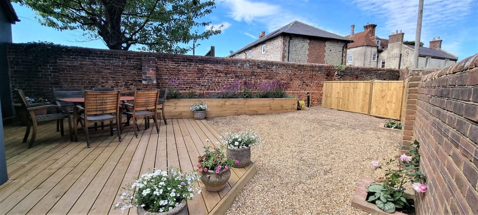Cosy east facing walled courtyard which can be accessed from the living room.