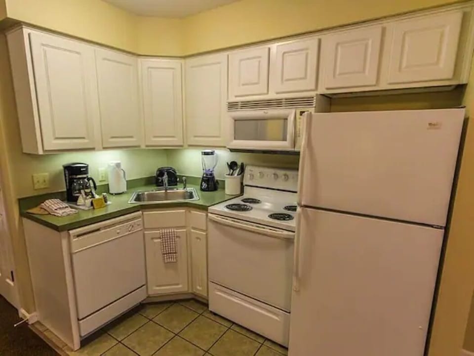 TWO full kitchens offer all the comforts and conveniences of home