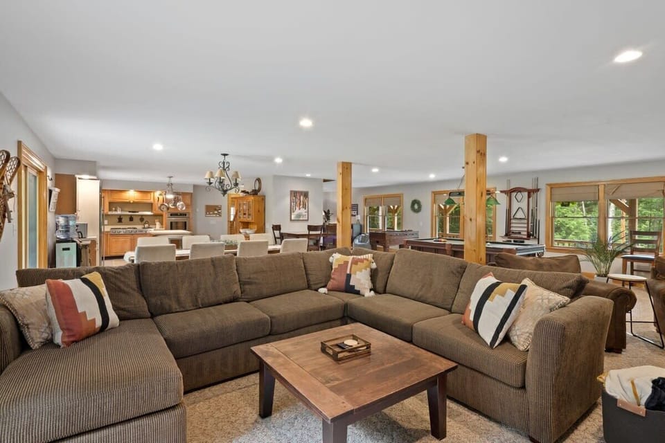 Spacious first floor with pool table, foosball, couches, wet bar, dining room and kitchen!