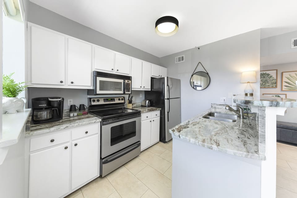 Modern Kitchen amenities and granite counter tops.