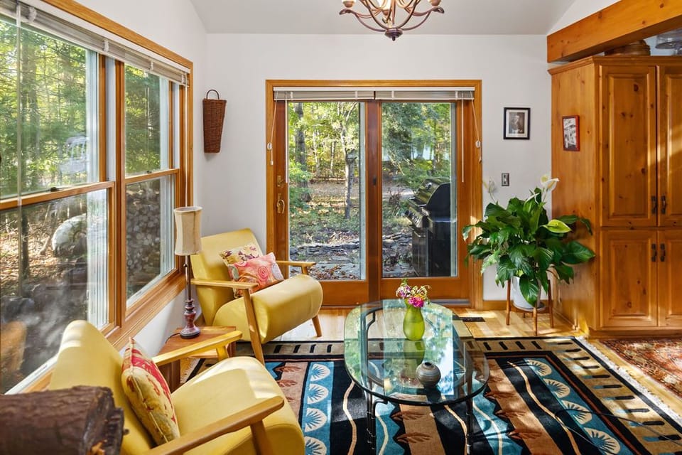 Coffee nook with doors to deck off the kitchen with a gas grill.