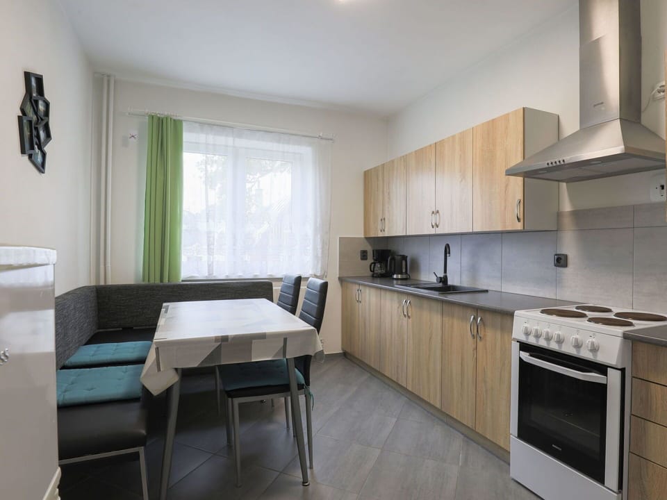 Furniture, Cabinetry, Countertop, Kitchen Stove, Couch, Kitchen Appliance, Window, Wood, Kitchen, Cooktop