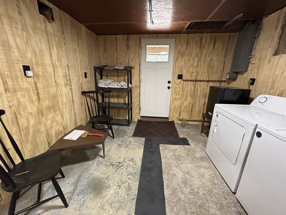 washer and dryer, additional towels, fishing rod holders, and outside door