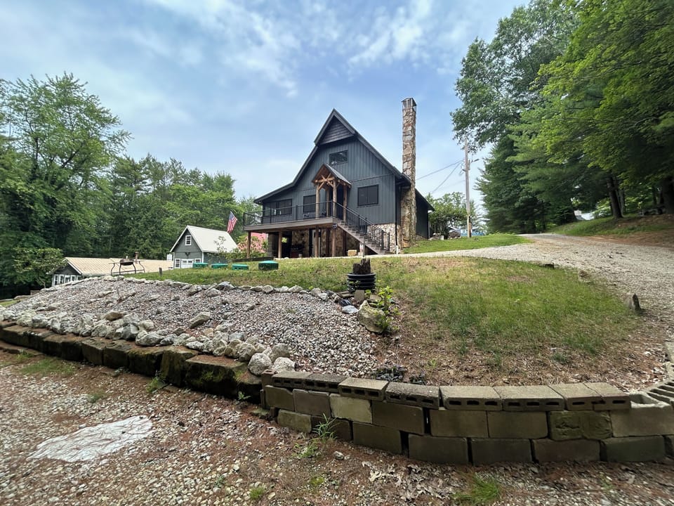 trailer parking spot and view of the front of the house