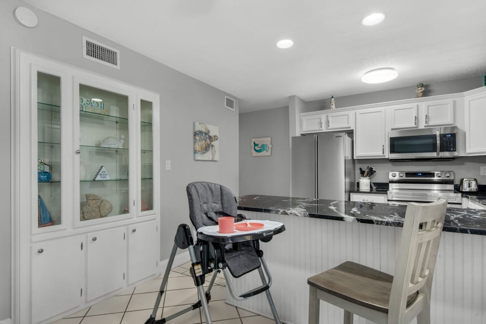High Chair with kids cups, bowls, plates, & utensils. Pack less & Relax more!