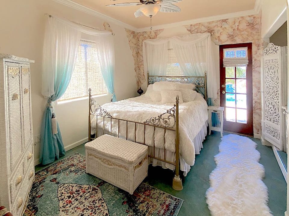 White on white comfy bed,  Amoire TV, his/hers closet, chest of drawers