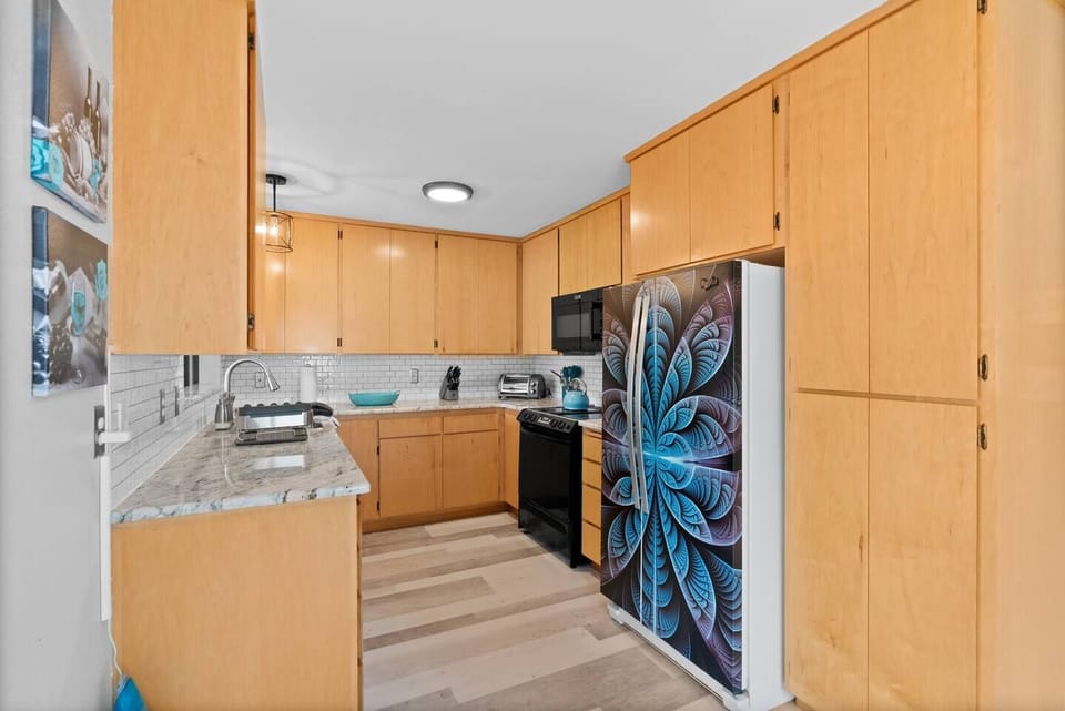 Kitchen appliances include large Instant Pot, high-speed blender, toaster oven, hand mixer, tupperware, full cookware set. Shot glasses, flutes, and stemless wine glasses to enjoy wine from the local wineries.