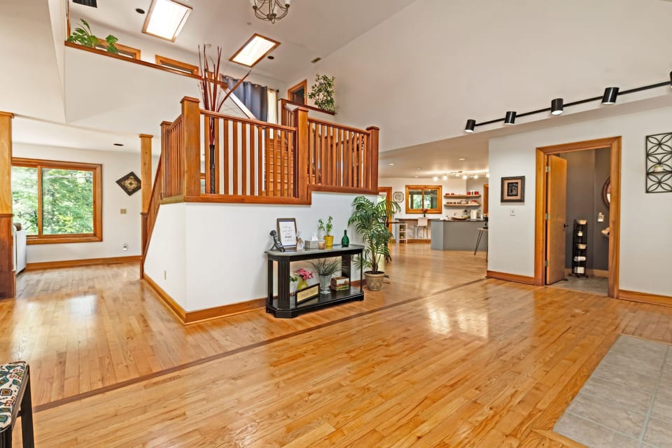 Front entrance. View of stairs, and landing. 