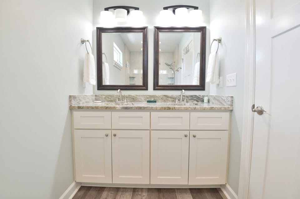 double sink with primary king bedroom en suite