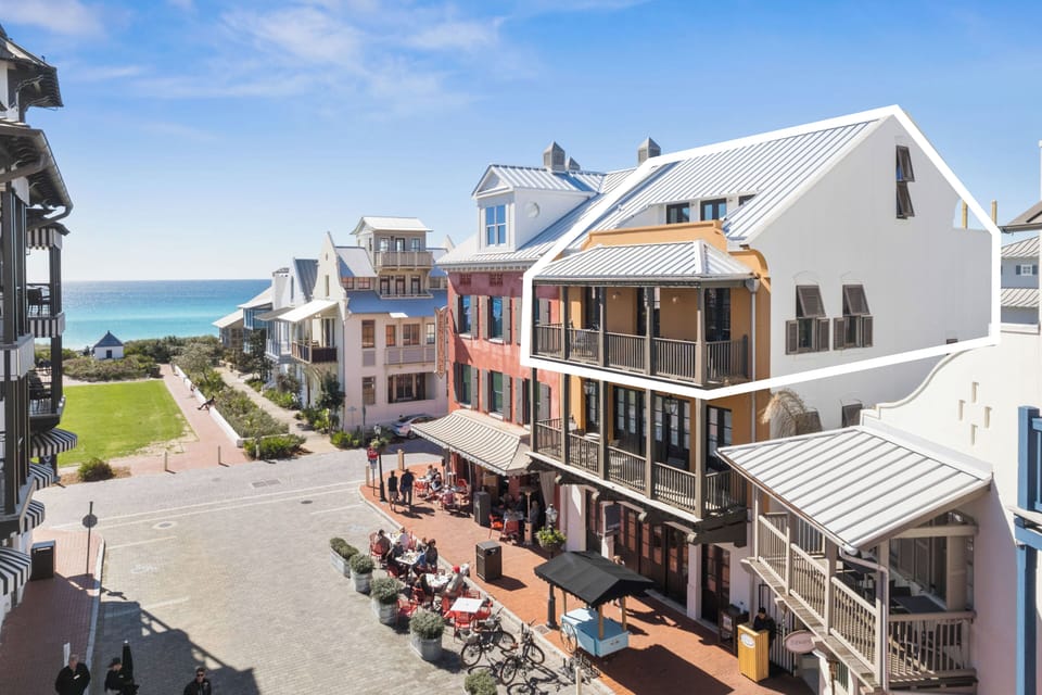 Antigua Penthouse spans the third and fourth floors of the white and orange building, and is a 2 minute walk to all of Rosemary Beaches dining and shopping.