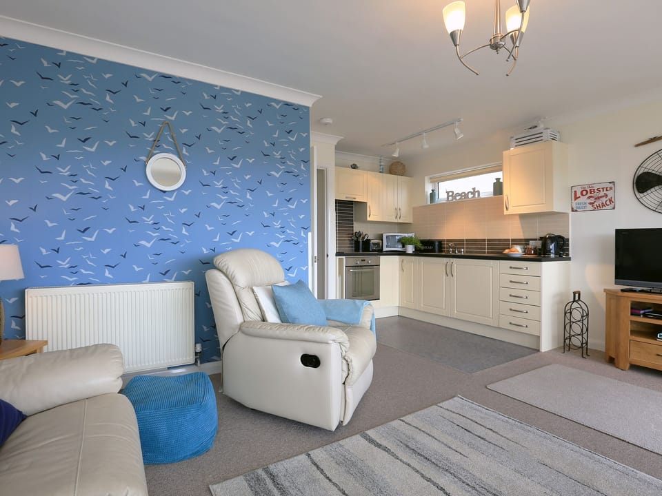 Living area and adjacent kitchen | Dual View - Linden Court Apartments, Brixham