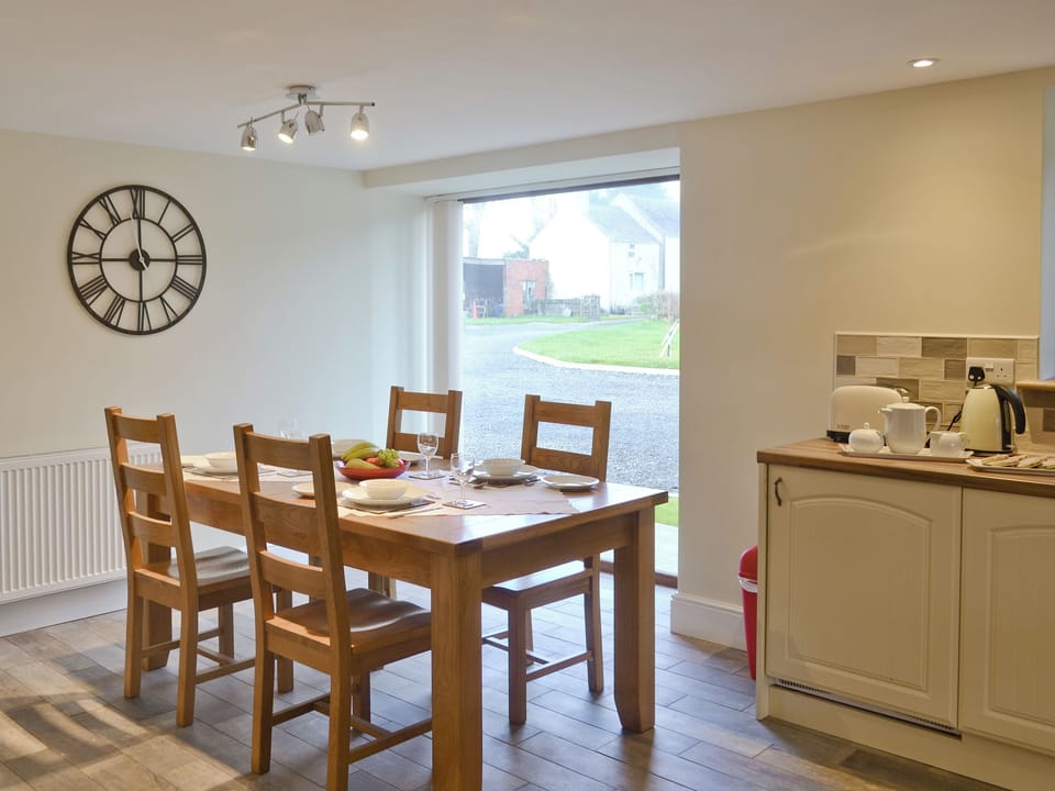 Airy dining area | Rhiwal Kitty - Trehwfa Cottages, Bodedern, near Holyhead