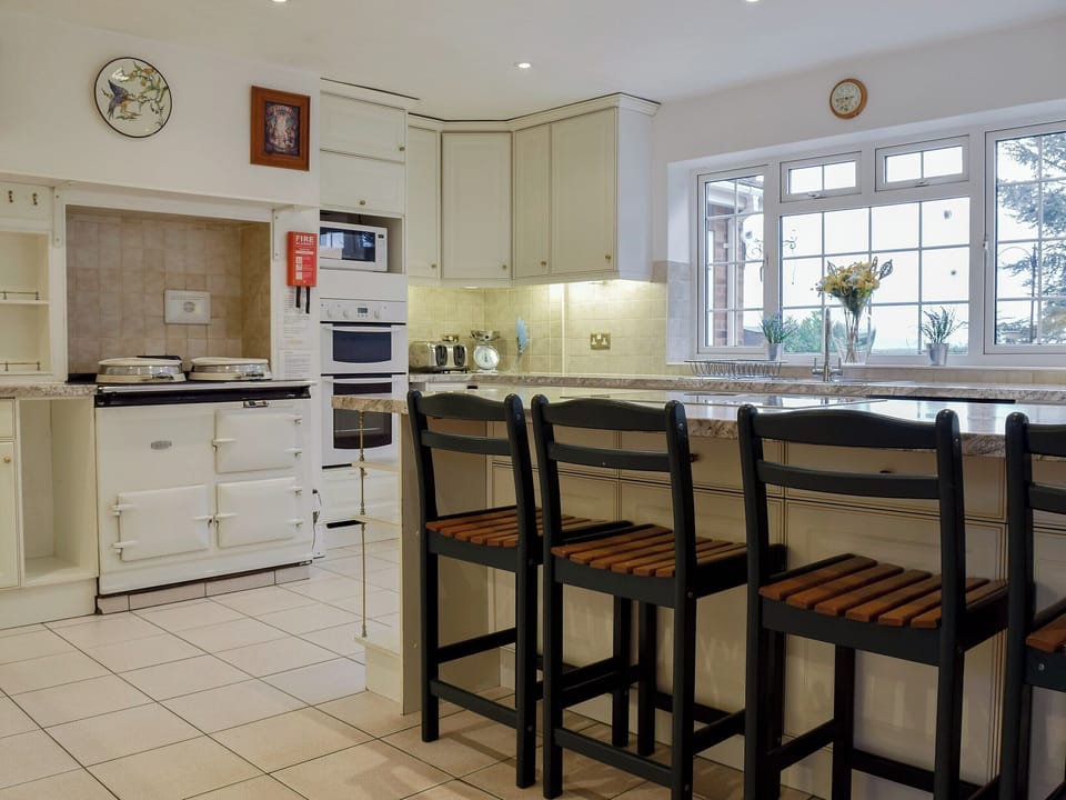 Large country kitchen with Aga range stove | New Inn House, Abbots Salford, near Stratford-upon-Avon