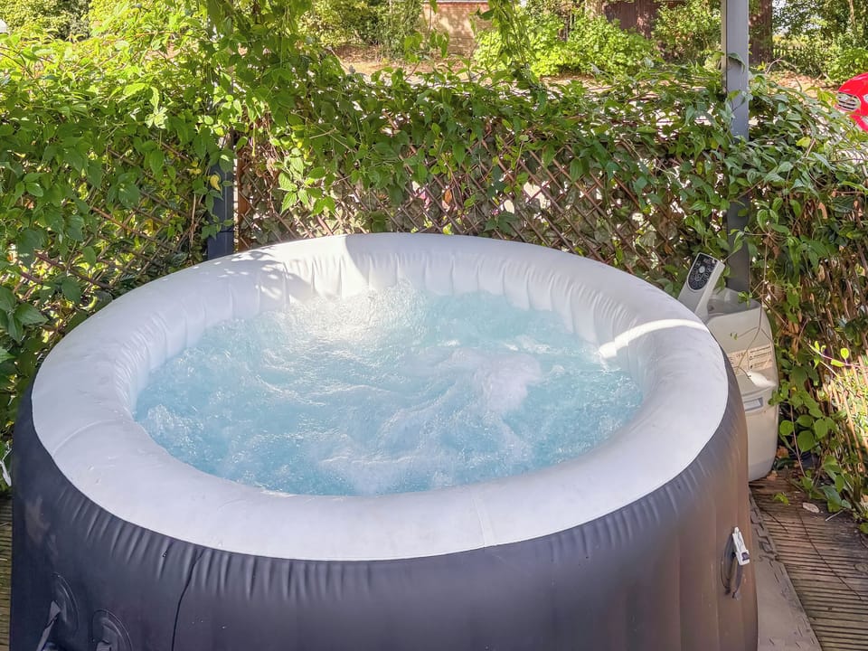 covered private hot tub | The Old Kitchen - The Old School House Accommodation, Burwarton, near Bridgnorth 