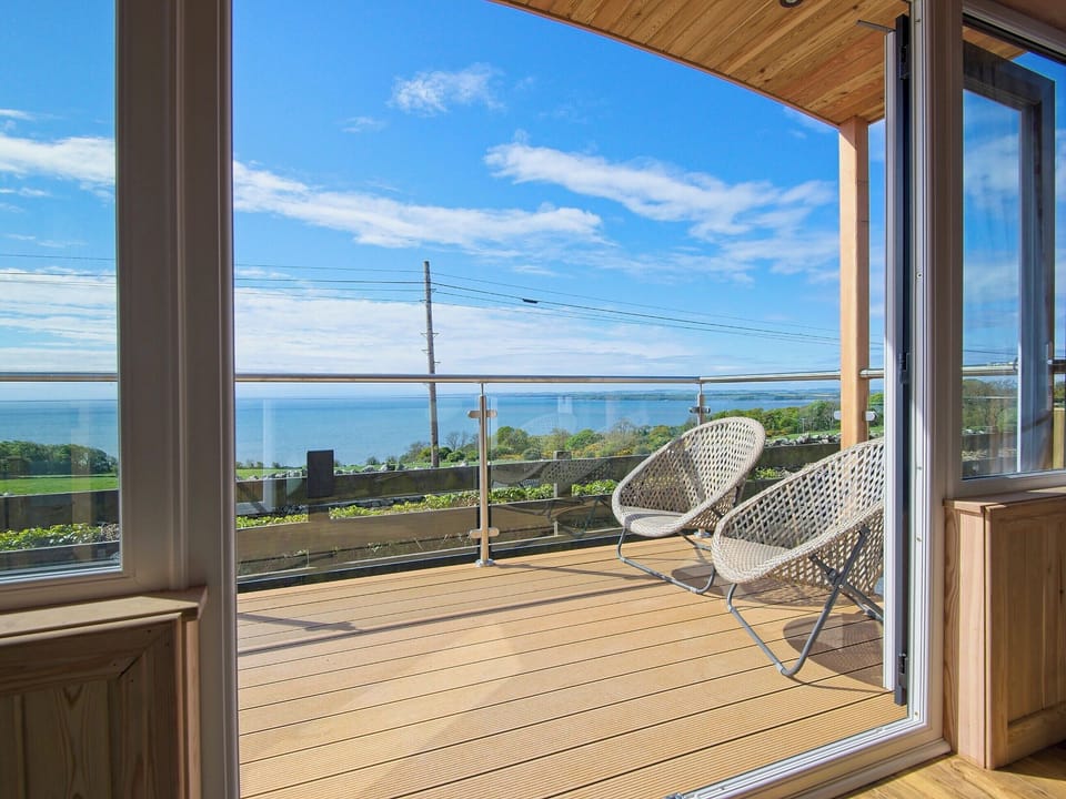 Enclosed verandah with garden furniture | Little Beach - Drumbain, Near Gatehouse of Fleet