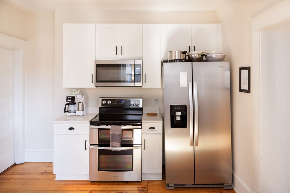 Kitchen with cooking essentials and modern appliances.