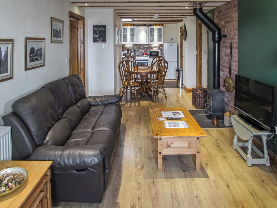 Wonderful open plan living space with exposed beams, cosy wood burner | Reed Lodge - Wood Fen Lodges, Little Downham, near Ely