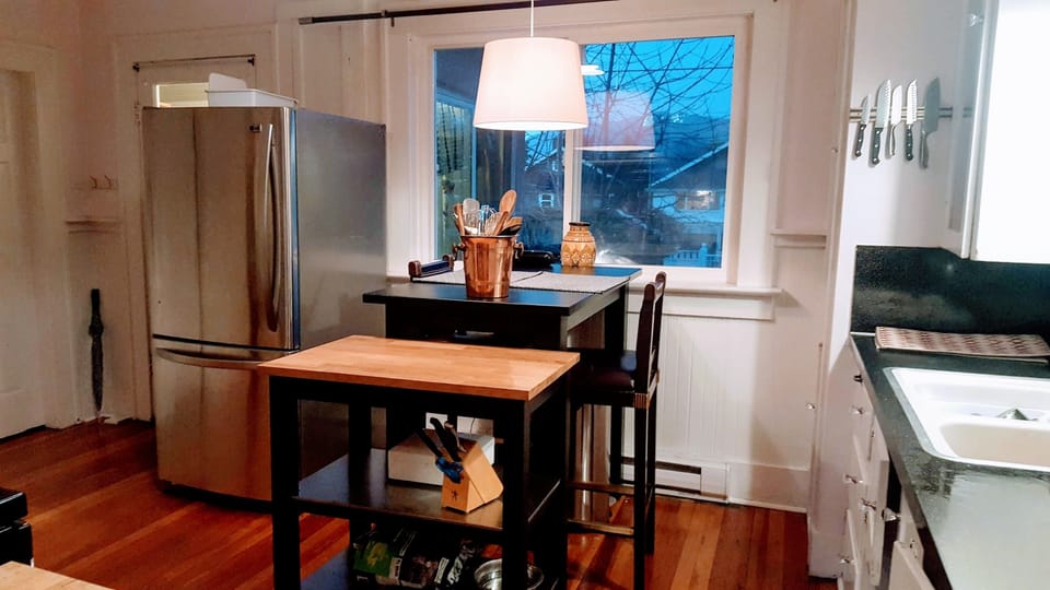 Kitchen Island with 2 chairs.