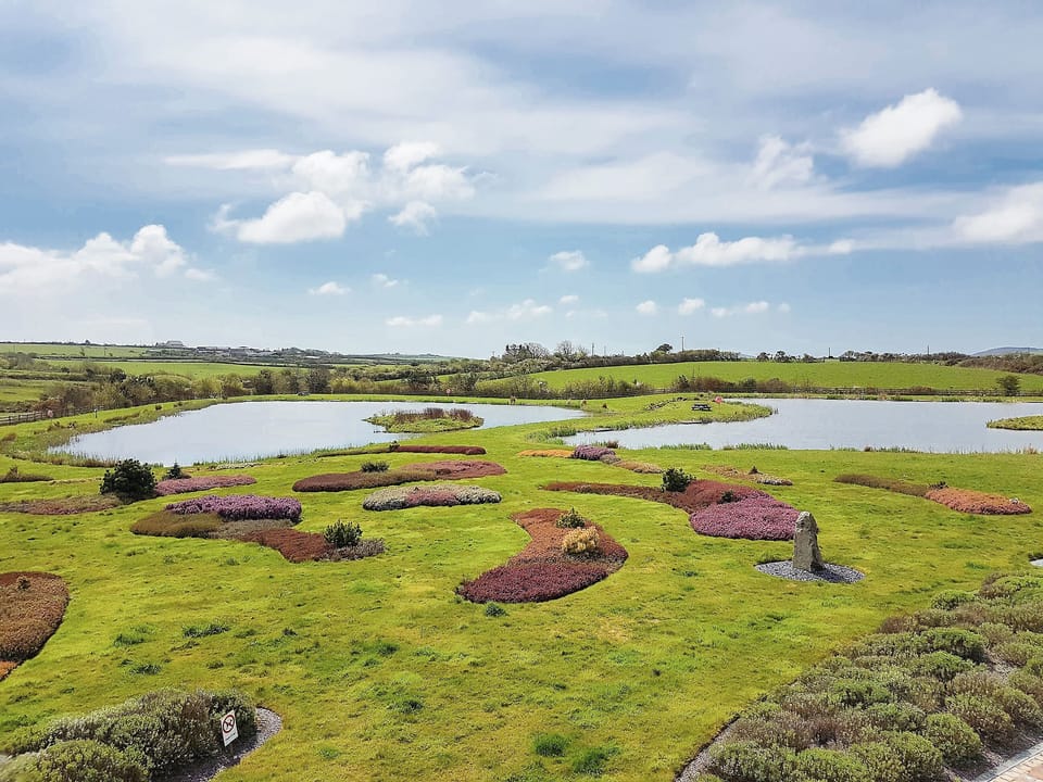 Splendid view over the shared landscaped gardens and coarse fishing lakes | Hafen Deg - Bodrydd, Rhoshirwaun, near Pwllheli