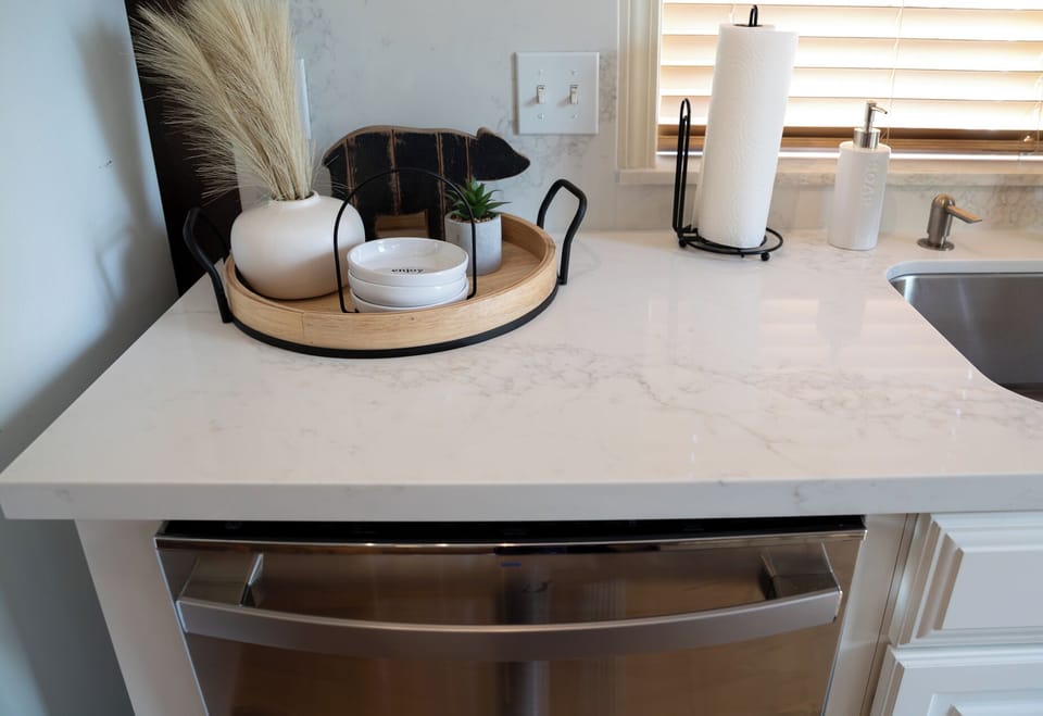Elegant quartz countertops bring a fresh feel to the cabin kitchen.