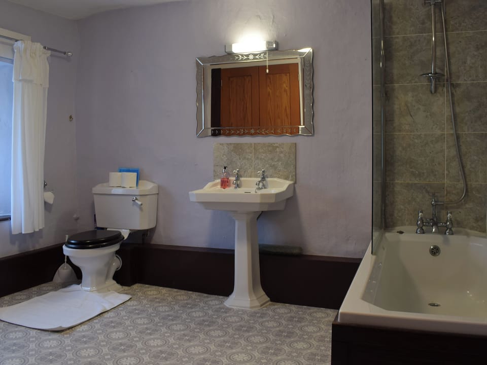 Bathroom with shower over the bath | Oak Cottage - Round Hill Farm, Kirkstone near Ambleside