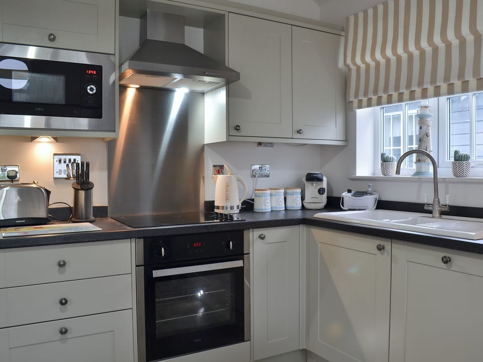 Charming and practical kitchen layout | Sandy Bay Beach House - The Bay, Filey, near Scarborough