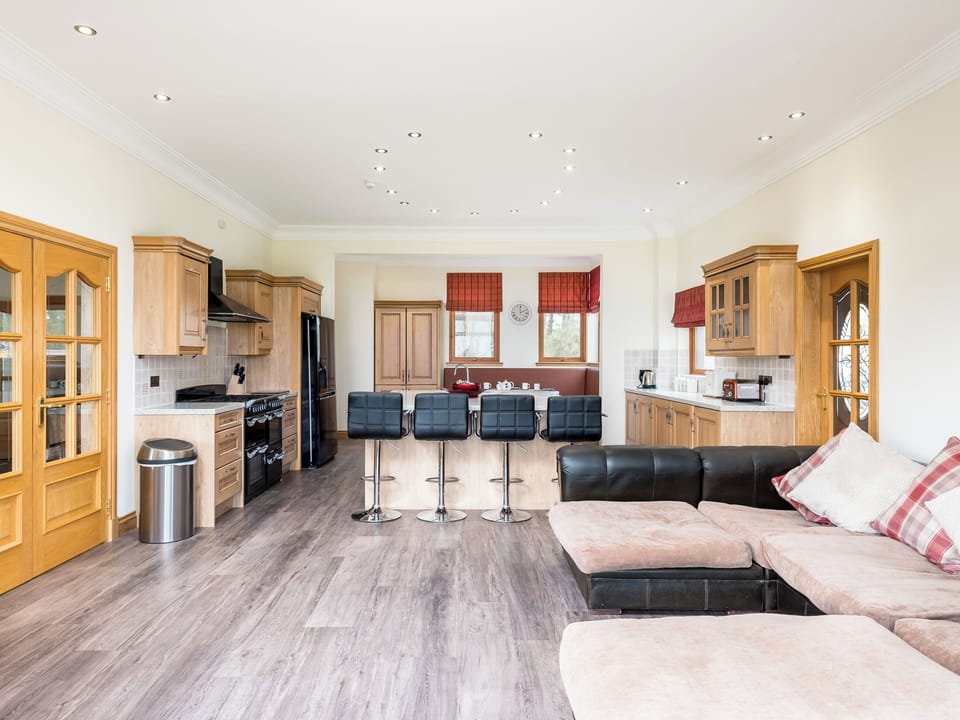Family seating area with Smart TV in the kitchen and dining room | Piperdam House, Piperdam, near Dundee