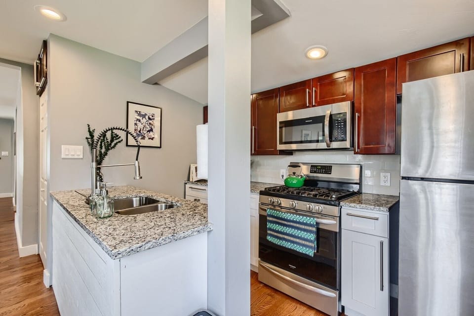 Kitchen also includes microwave, refrigerator and dishwasher