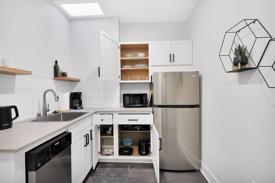 Equipped with dishes, cutlery, pots & pans, cooktop, refrigerator/freezer, toaster, microwave, dishwasher, coffee maker and electric kettle