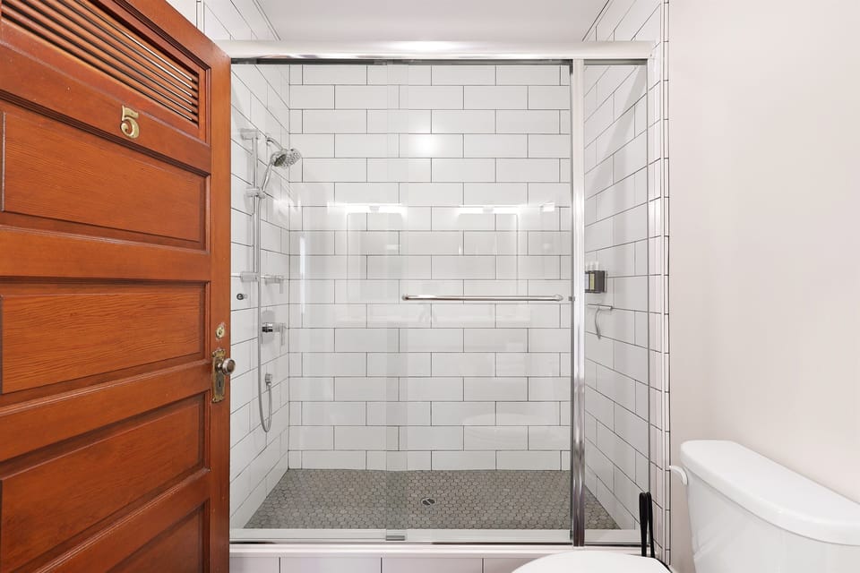 Custom tile walk-in shower with upscale Guild & Pepper shampoo, conditioner & body wash made from natural ingredients & essential oils (our products do not contain parabens, phthalates, petrol-derived ingredients or mineral oil).