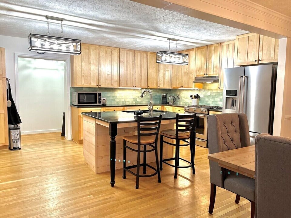Fully stocked kitchen with bar seating. Kitchen is equipped with gas stove, refrigerator, microwave, dishwasher, convection toaster oven, toaster, and 12 cup pot standard drip coffee machine,  & keurig. Coffee, tea, and sugars provided!
