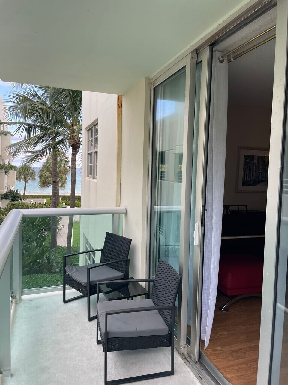 chairs and table on the balcony to enjoy ocean breeze 