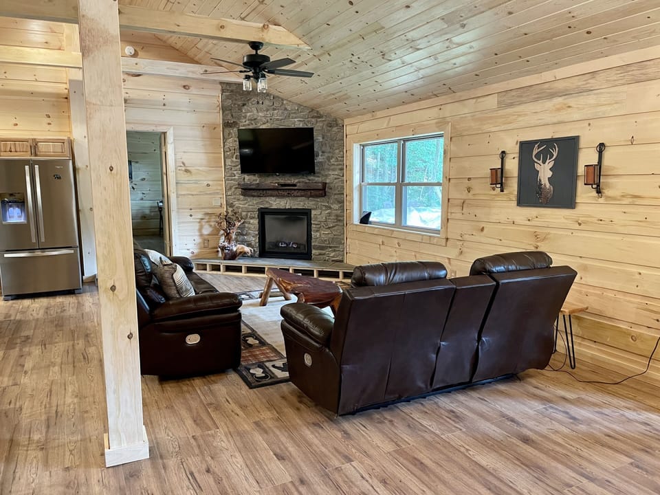 Family room with cable tv, gas fireplace, electric reclining sofa and love seat