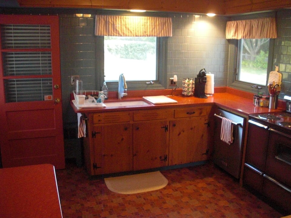 Kitchen with original pine cabinets, deep farmhouse sink, lots of counter space.