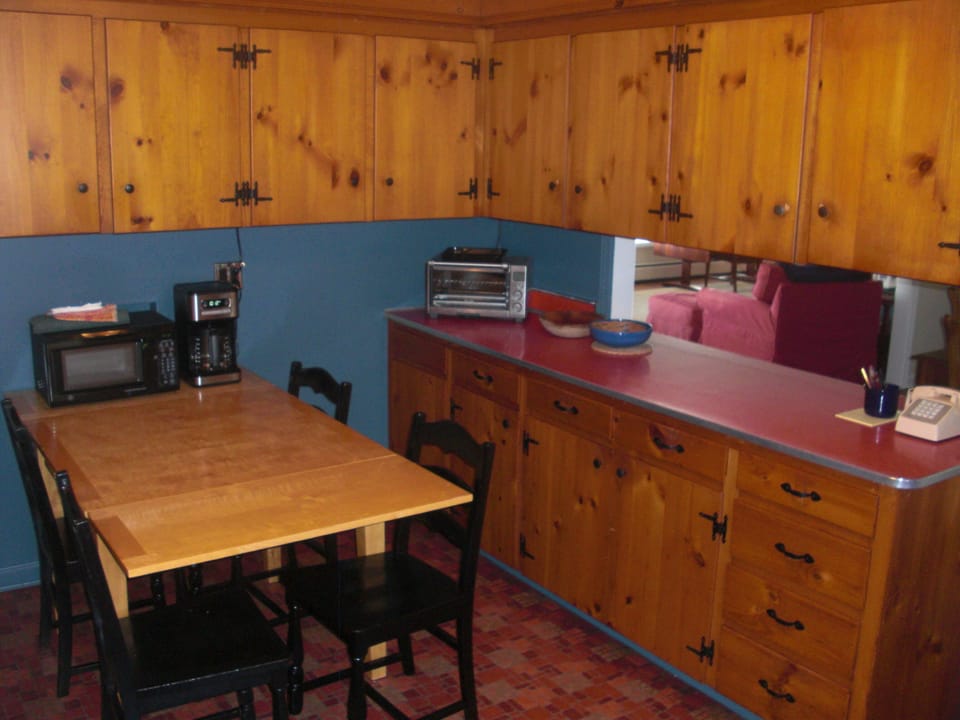 Kitchen counter service area opens to dining room.