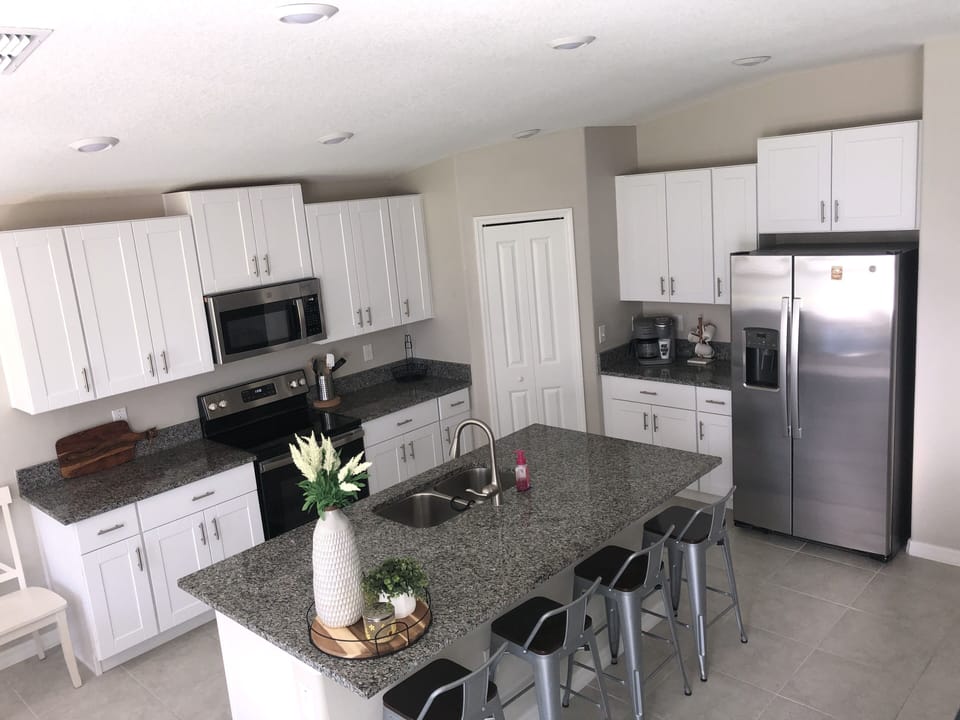 Bright airy kitchen with plenty of storage space