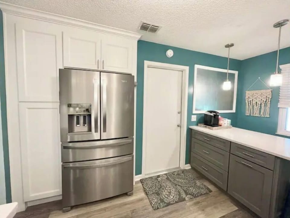Large stainless refrigerator with ice and water in the door
