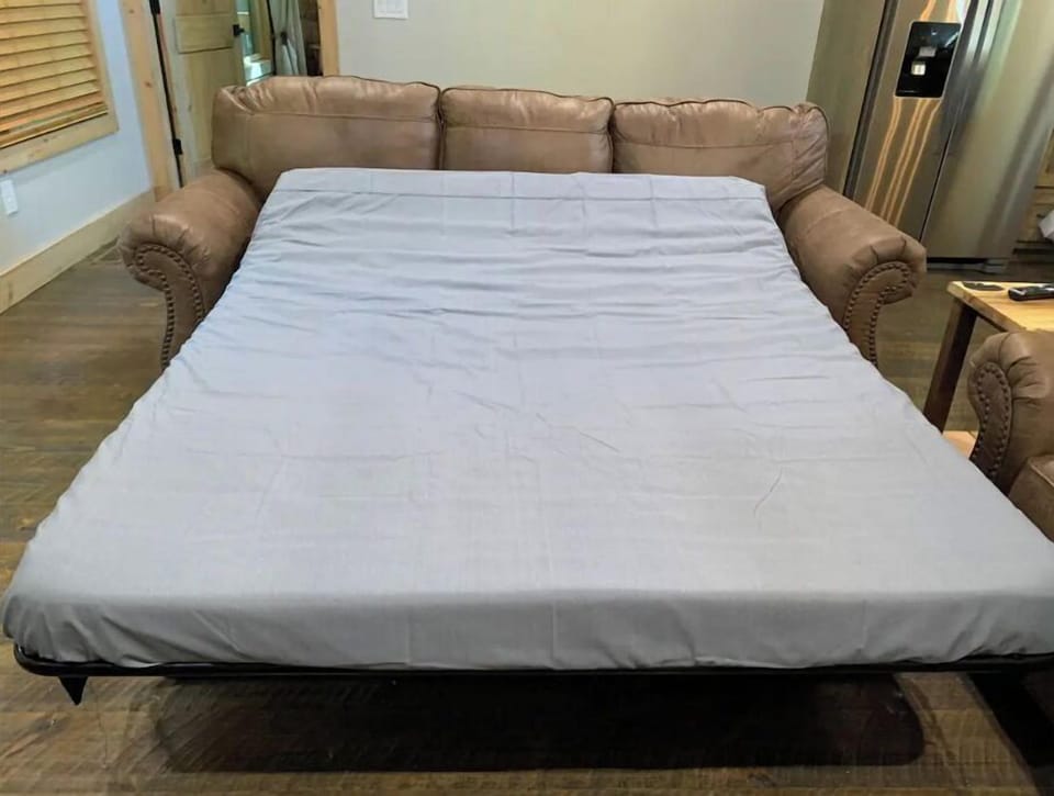 Queen sleeper sofa in family rm. Mattress is brand new & has adjustable headrest