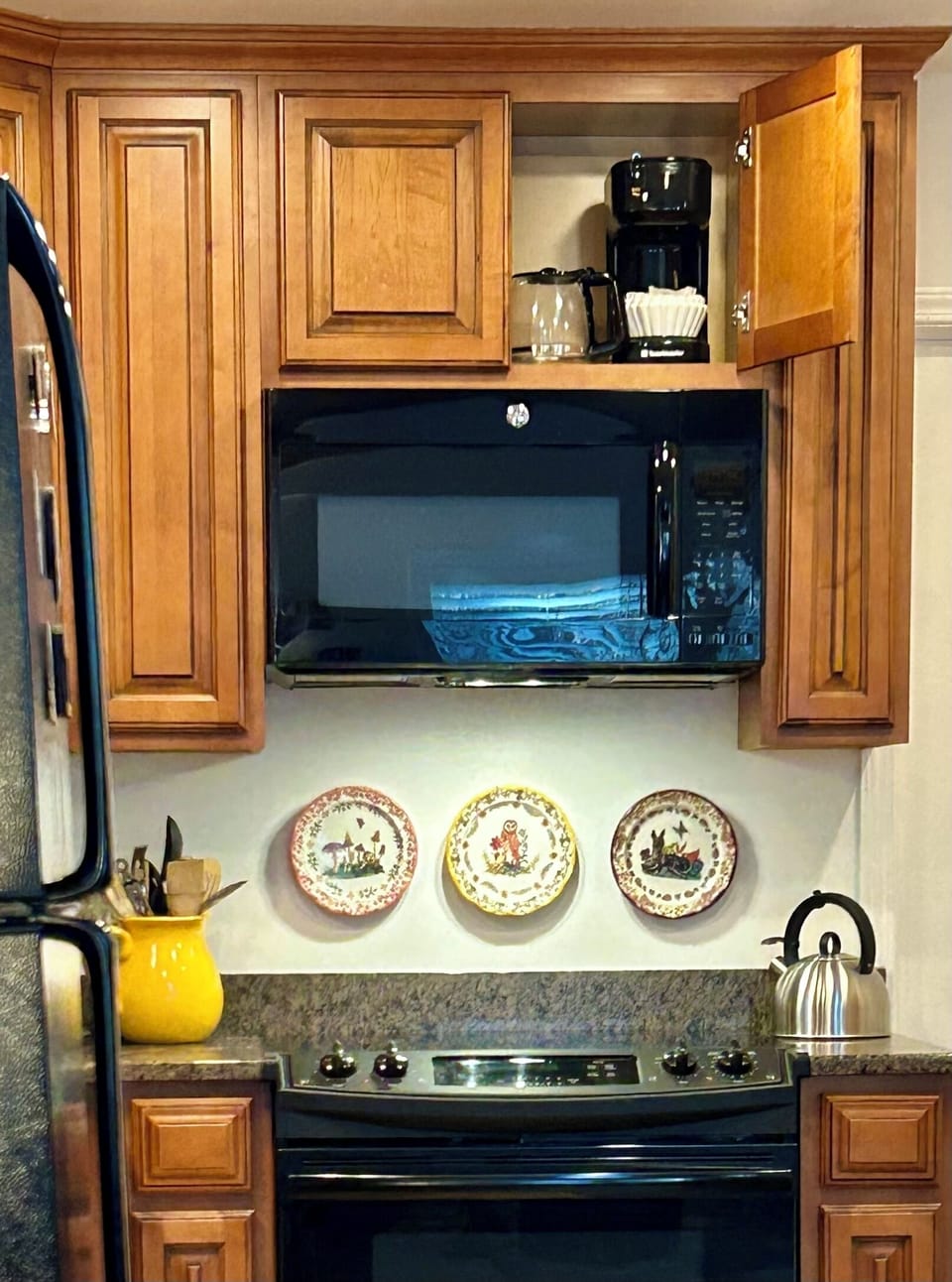 There is also a drip coffee maker located in the cabinet above the microwave.