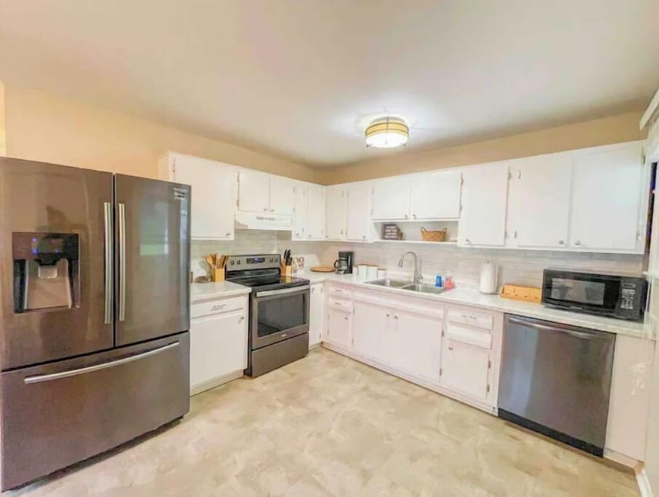 Fully equipped kitchen with full size black stainless steel appliances.  