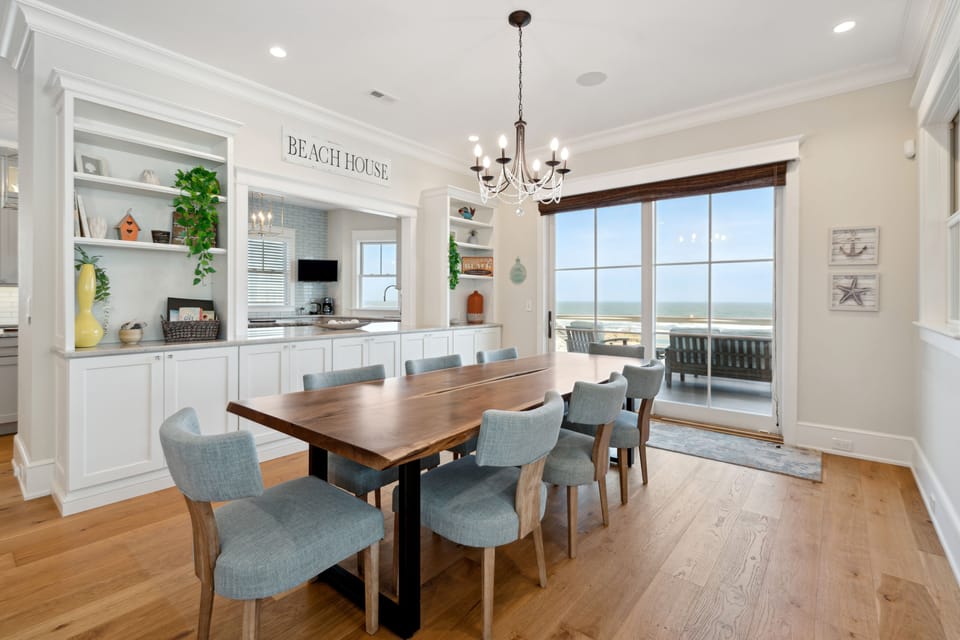 Custom dining table featuring seating for 8 and ocean view.