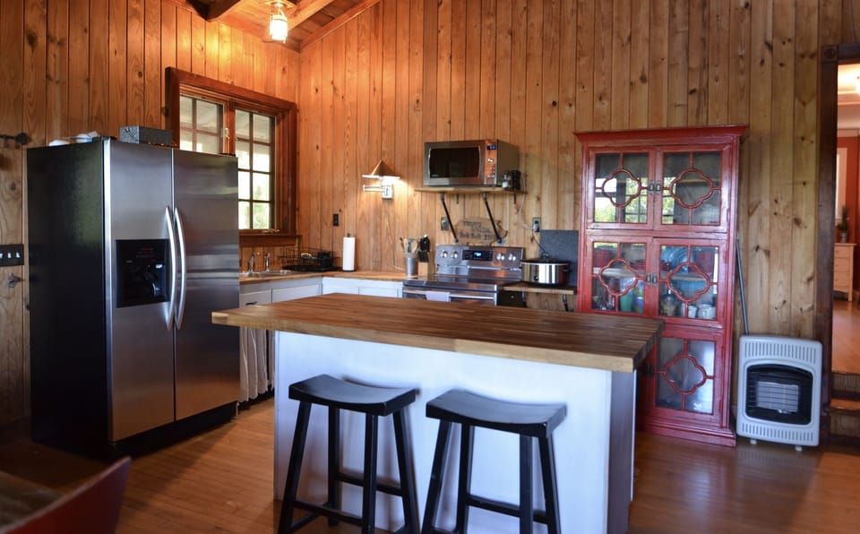 Stocked kitchen and large island for serving food